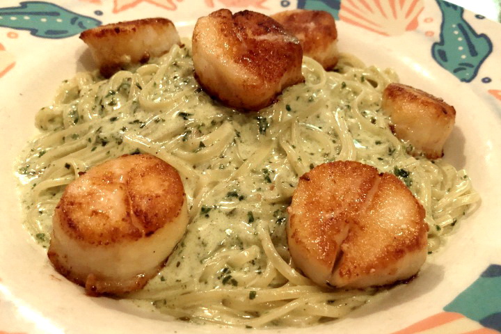 photo of pan-roasted sea scallops with pesto cream sauce from Out of the Blue, Somerville, MA