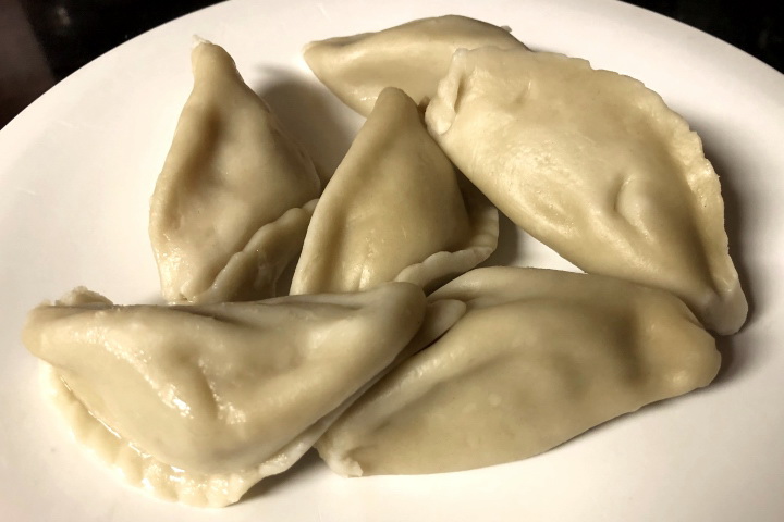 photo of pork cooked dumplings from Home Taste, Watertown, MA