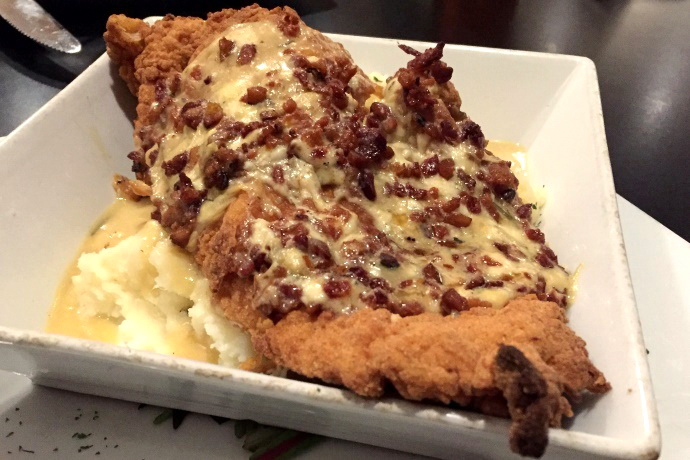 photo of a chicken plate with bacon, mashed potatoes, and bleu cheese from Louis, Quincy, MA
